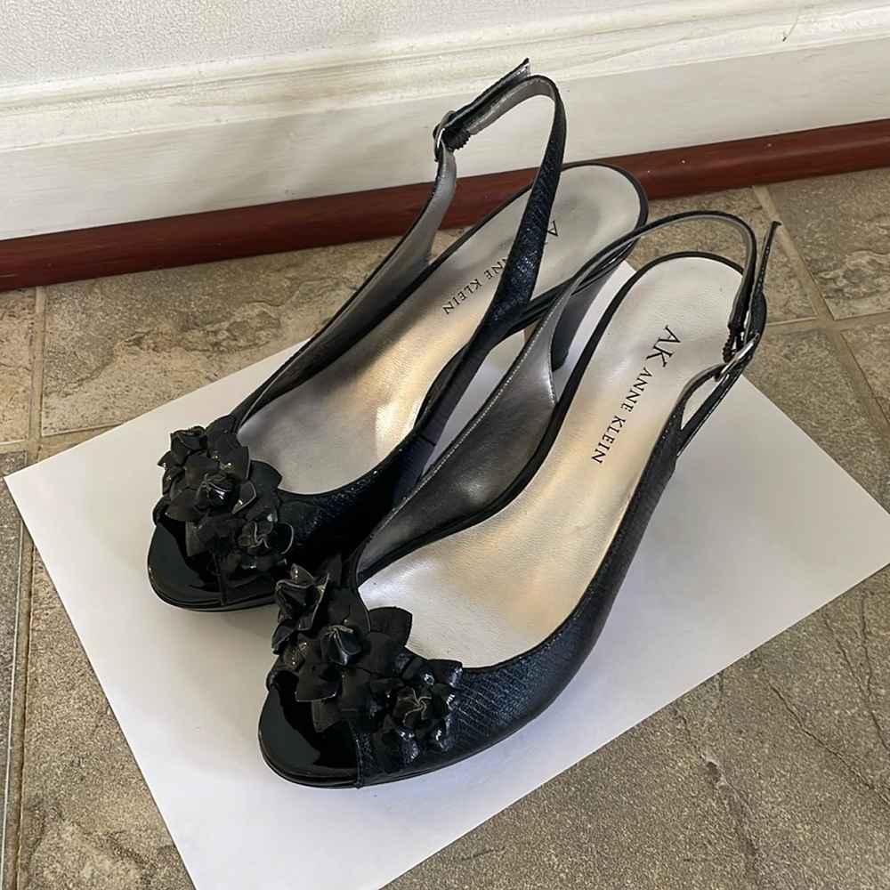 Black sling back heels with flower appliqué